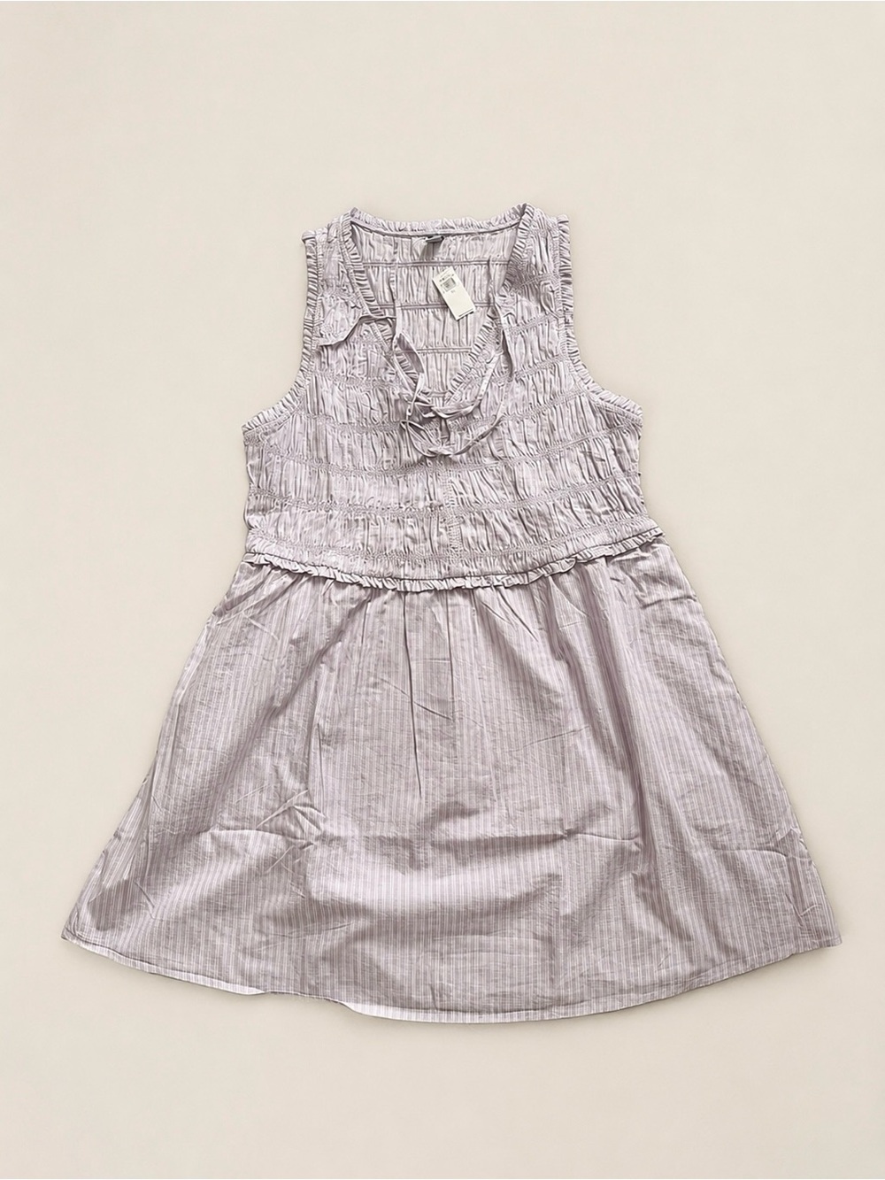 Lavender tank dress with subtle pin stripes and smocked bodice. New with tags